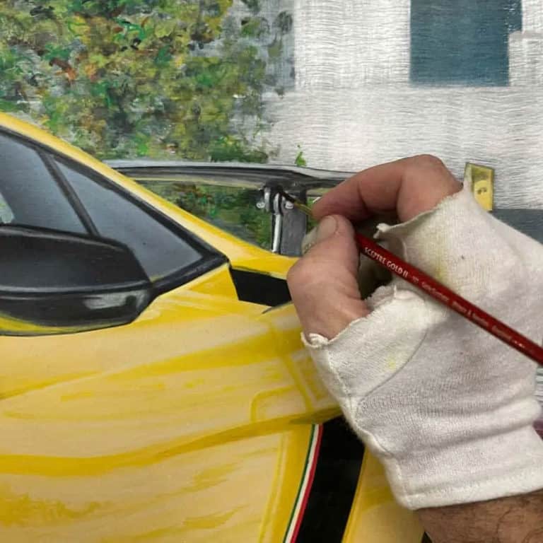 A.D. Cook painting Lamborghini spoiler